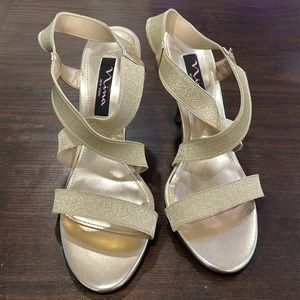 Never worn gold strappy Nima heels